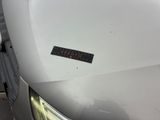 a sticker on the hood of a white car