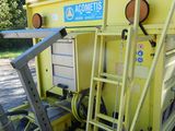 a yellow dump truck that is parked on the side of the road