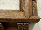 a picture of a wooden shelf with a mirror on it