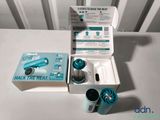 a box of toothbrushes sitting on a table next to a box of toothpaste