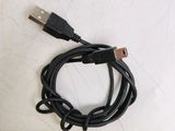 a close up of a usb cable connected to a charger on a white surface