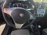 a steering wheel and dashboard of a car on the road