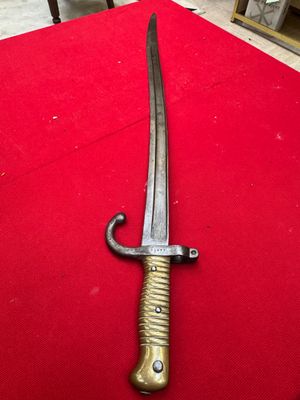 a picture of a knife on a red cloth