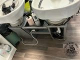 a picture of a bathroom with two sinks and a hair dryer
