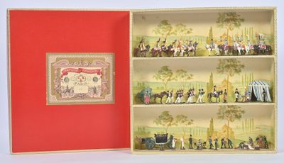 a red box with miniature figurines of people in it