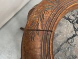 a close up of a clock on a table