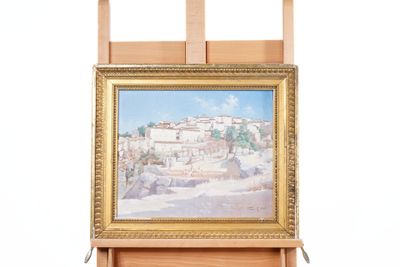 a picture of a painting on a easel with a picture of a town in the background