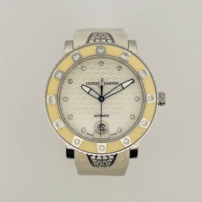 an image of a close up of a watch on a white surface