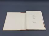 an open book sitting on top of a blue table
