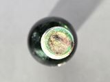 a close up of a bottle of wine on a table