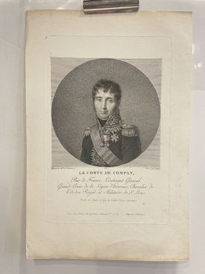 an old picture of a man in a military uniform in a glass case