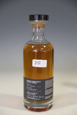 a bottle of alcohol that is sitting on a table