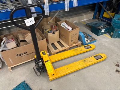 a fork truck that is parked in a warehouse