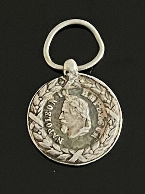 l'image d'une pièce d'argent sur laquelle figure le visage d'un homme