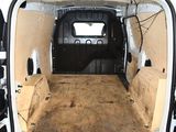 a white van with a black door and a brown floor