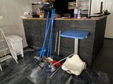 a picture of a room with a bar and tools on the floor