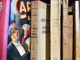 many books that are on a shelf in a room