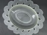 a clear glass bowl with a decorative design on it