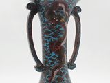 a vase with a handle on it on a white background