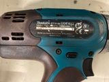 a cordless drill that is sitting on a table