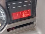 a close up of a car dashboard with a clock on it