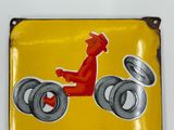 a yellow sign with a picture of a man on a tractor