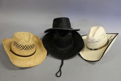 three hats are lined up on top of each other on a table