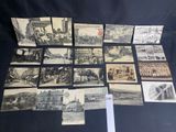 an old photo of a bunch of old postcards on a table