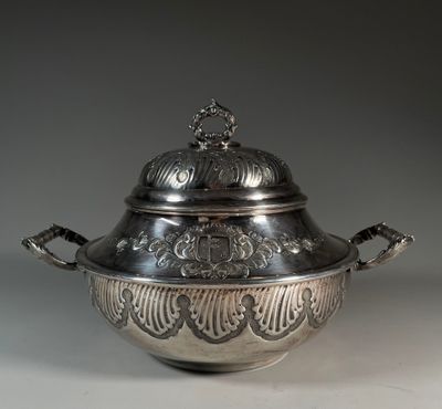 an antique silverplated bowl with a lid and handles