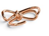 an image of a rose gold bow ring on a white background