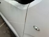 a close up of a car door handle with a sticker on it