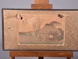 a picture of a painting on an easel with a bird flying over it