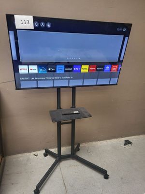 a flat screen tv on a stand in a room