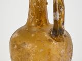 a brown vase with a handle on a white background
