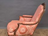 an old chair with pink upholstered upholstered upholstered upholstered upholstered up