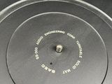 a close up of a turntable on a table