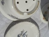 three plates and a tea pot on a table
