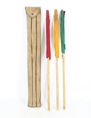 several different colored croquets are lined up on a white surface