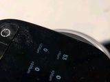 a close up of a cell phone sitting on a table
