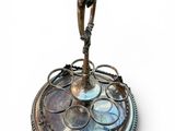 a silver plate with a figurine on top of it