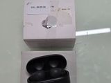 an apple airpods in the box and a cigarette in the box