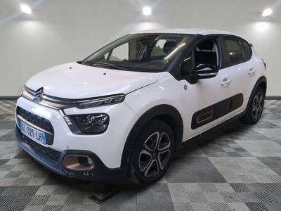 the white citrole is parked on a checkered floor