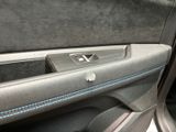 a close up of a car door handle with a remote control