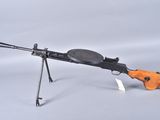 an orange and black toy gun on a stand with a white background