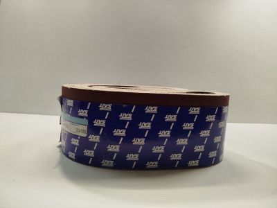 a close up of a roll of blue tape on a table