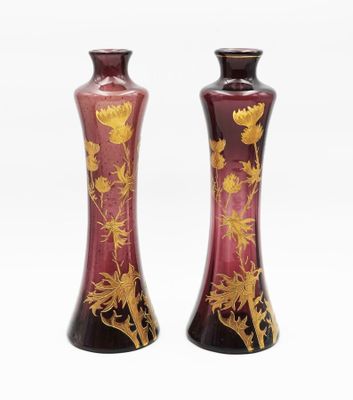 two vases that have been decorated with flowers on them
