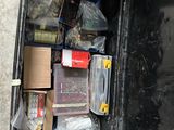 a black trash can with many items in it