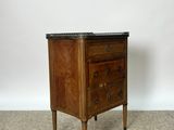 an image of a small wooden chest of drawers with a marble top