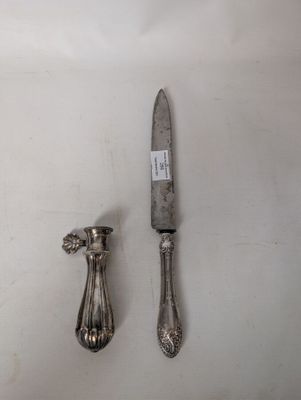 a knife and a spoon sitting on a table