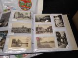 a lot of old black and white photos on a table